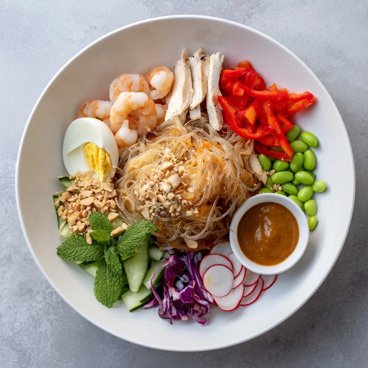 A colorful Asian Fusion Noodle Bowl Board with vibrant veggies and savory dipping sauces.