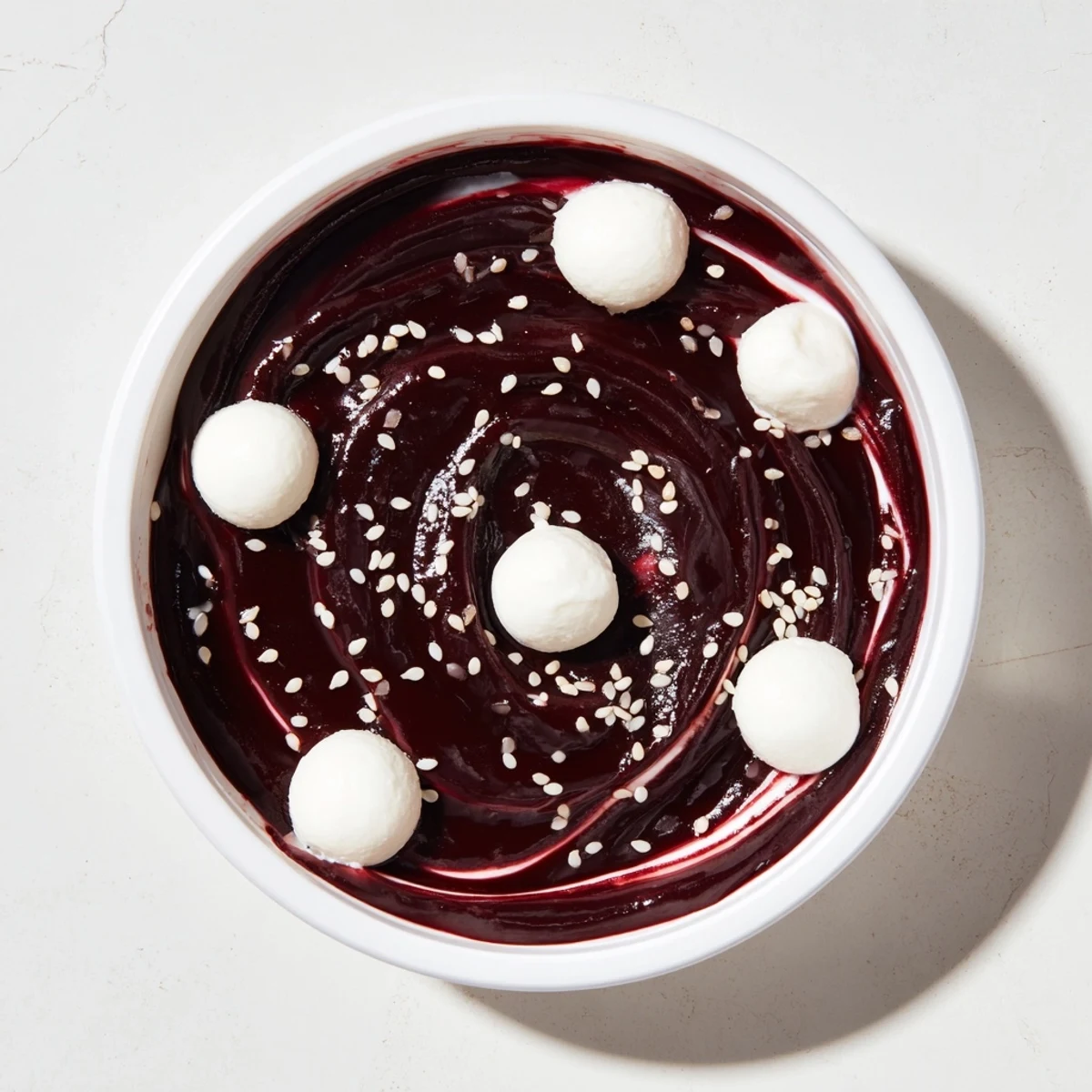 The Galaxy Spiral dessert: creamy yogurt swirled with dark berry jam and goat cheese stars.