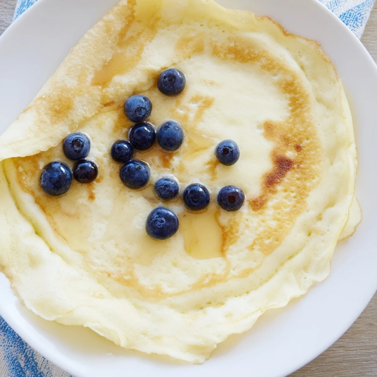 Golden-brown, fluffy scrambled pancakes, a delightful breakfast featuring soft, tender curds.