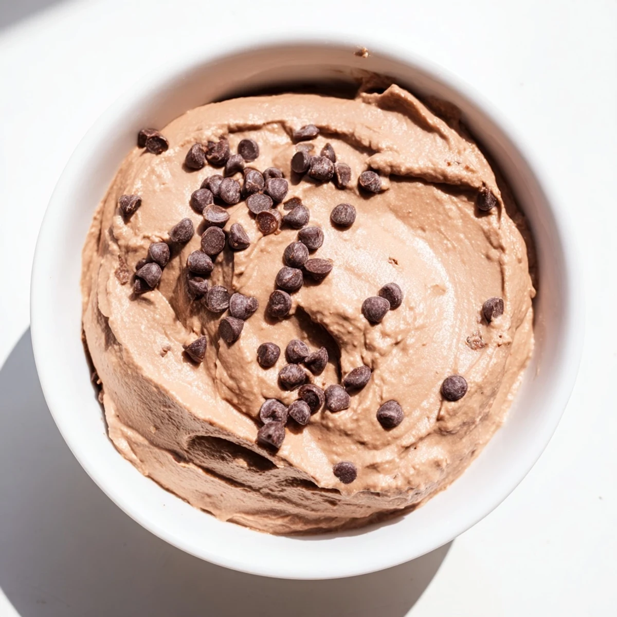 Decadent chocolate hummus, perfectly thick and rich, ready for dipping and a satisfying treat.