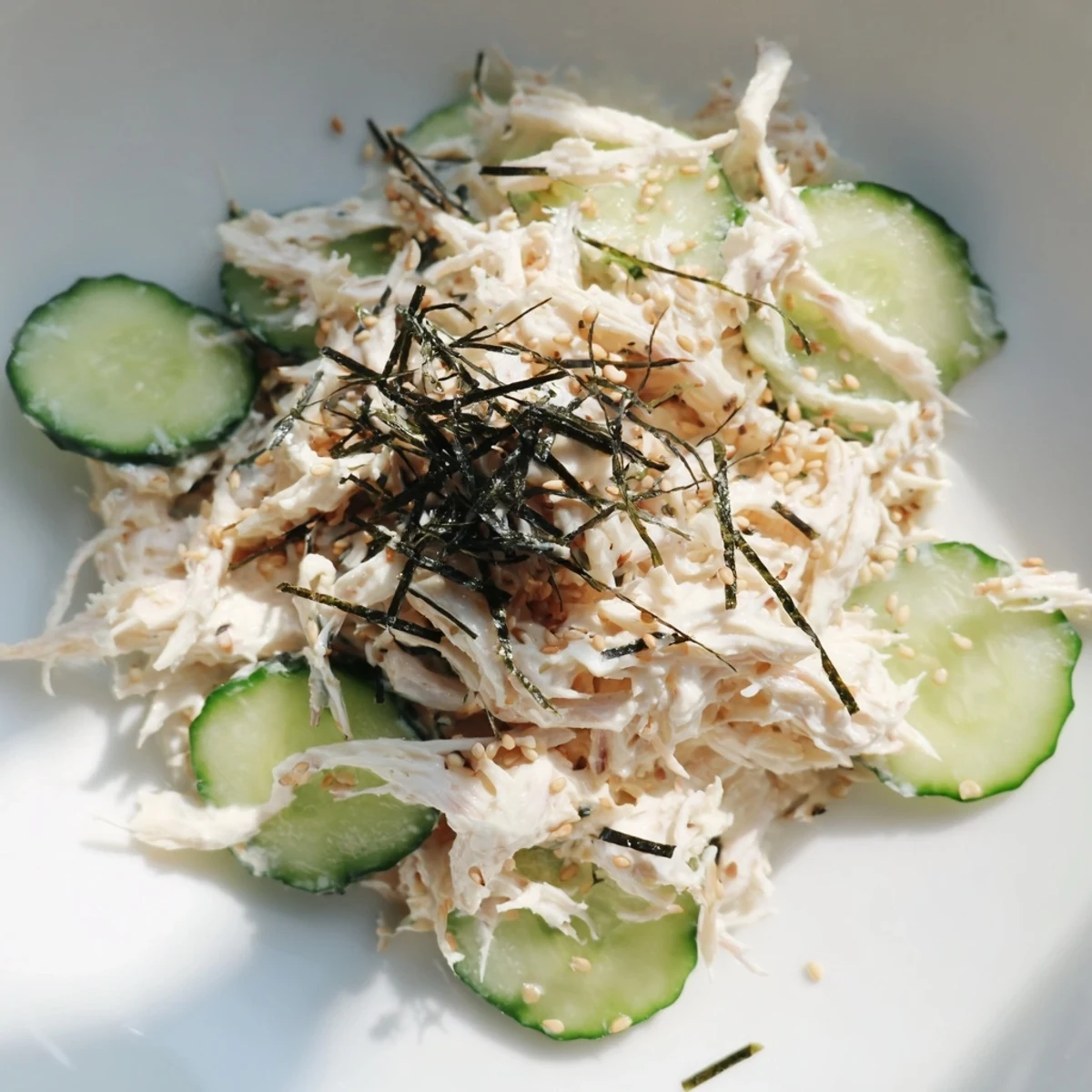 Crisp cucumber slices and creamy California Roll Cucumber Salad tossed with shredded imitation crab.  