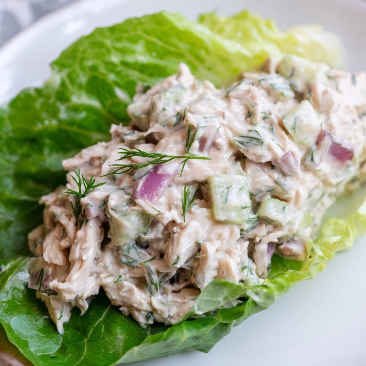 Dill Pickle Chicken Salad Lettuce Cups filled with creamy shredded chicken, crunchy pickles, and fresh dill in buttery lettuce leaves.