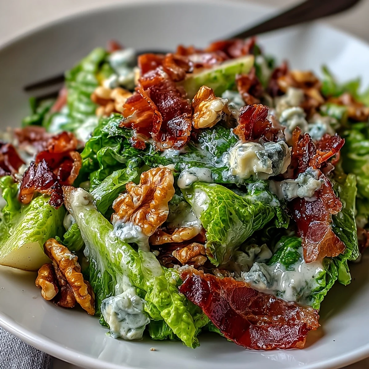 Crispy prosciutto shards add savory crunch to the frisée, pear, blue cheese, and crispy prosciutto salad with walnuts.