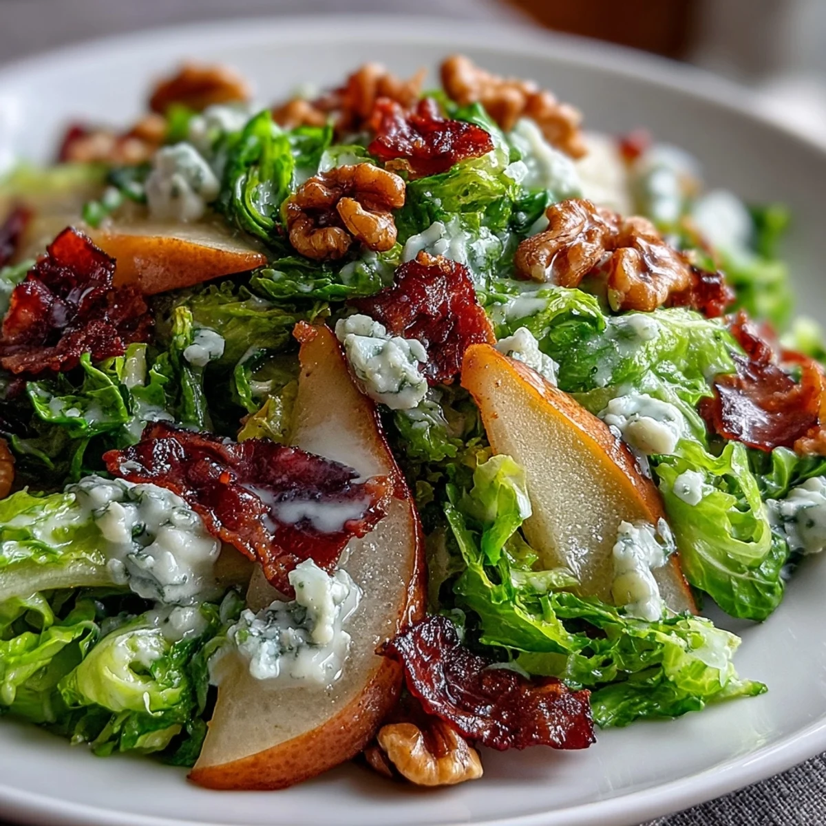 Juicy sliced pears and creamy blue cheese toss with frisée in this vibrant frisée, pear, blue cheese, and crispy prosciutto salad.