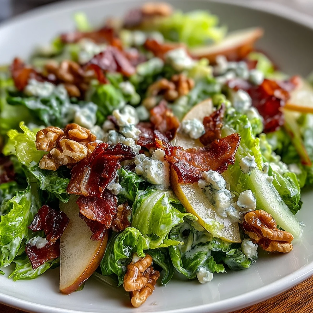 Served on a platter, the frisée, pear, blue cheese, and crispy prosciutto salad features a light honey vinaigrette glaze.