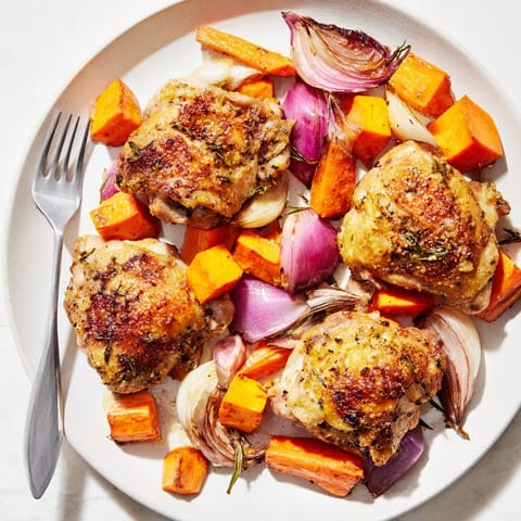 Juicy Honey-Glazed Chicken recipe with roasted carrots, parsnips, and sweet potatoes, ready to serve.