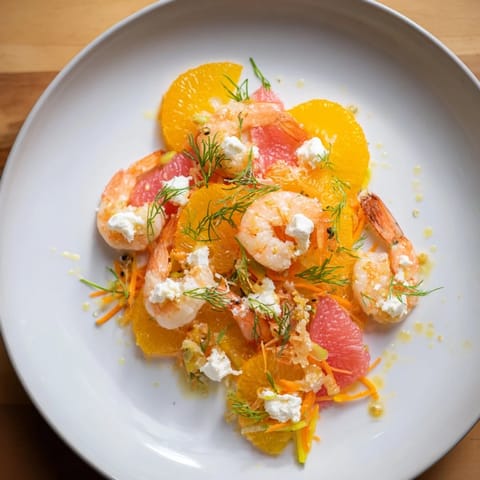 Delicious The Coral Reef featuring broiled Gruyère cheese, fresh herbs, and colorful shrimp.