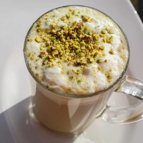 Warm, creamy Pistachio Latte, a beautiful homemade frothy beverage with a nutty flavor.