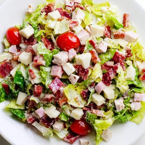 Fresh, colorful Italian Deli Chopped Chicken Salad is served with a tangy herb dressing, ready to enjoy as a hearty main dish.