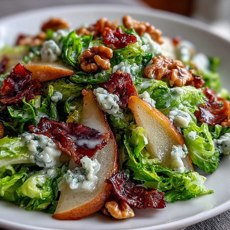 Juicy sliced pears and creamy blue cheese toss with frisée in this vibrant frisée, pear, blue cheese, and crispy prosciutto salad.