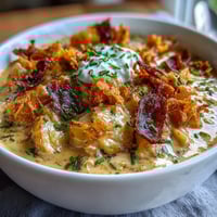 Creamy Funeral Potatoes Loaded Baked Potato Soup with crispy potato chips and melted cheddar in a rich, hearty bowl.