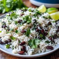 Vibrant coconut lime rice with beans, cilantro, and zesty lime flavors.
